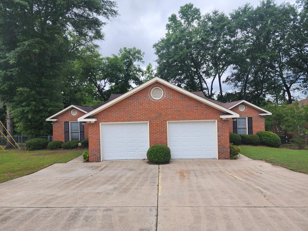 6 Maryland Court, Unit B Columbus, GA 31907 - Photo 1 of 15 a front view of a house with a yard and garage