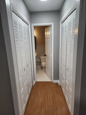 a view of a bathroom from a hallway