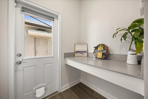 a bathroom with a glass shower door and a sink
