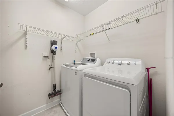 an aerial view of a house with a swimming pool