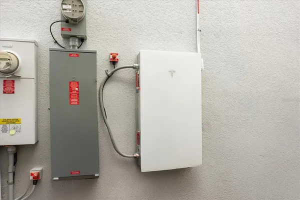 a view of a lake with a yard and large trees