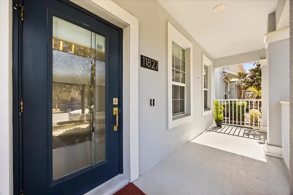 a kitchen with refrigerator cabinets and wooden floor