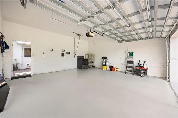 a view of a swimming pool with a patio and a garden