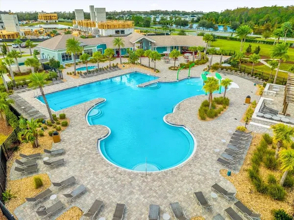 a view of a livingroom with furniture window and wooden floor
