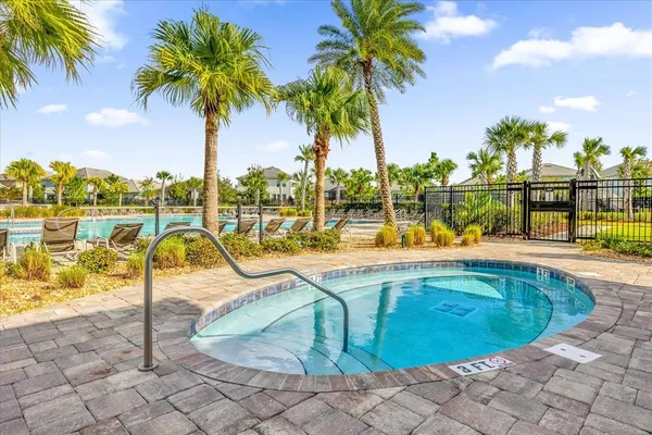an aerial view of a house with a yard and lake view