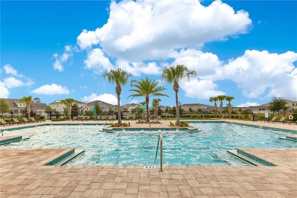 an aerial view of a swimming pool and outdoor space
