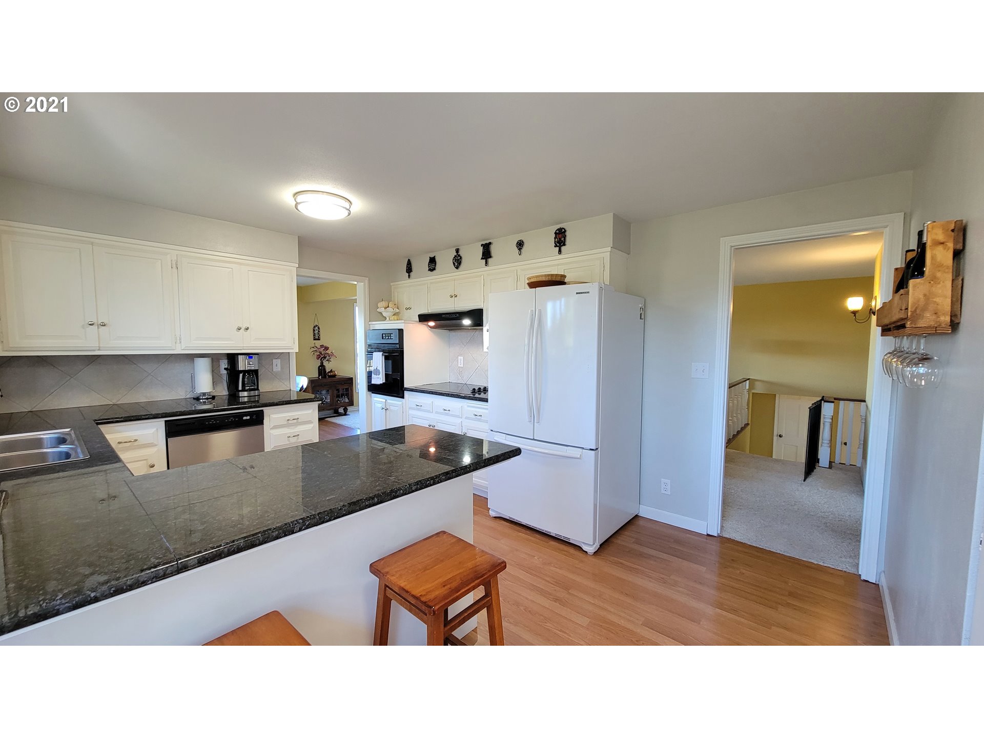 7622 Liberty Road South Salem, OR 97306 - Photo 6 of 32 a kitchen with stainless steel appliances granite countertop a sink refrigerator and cabinets