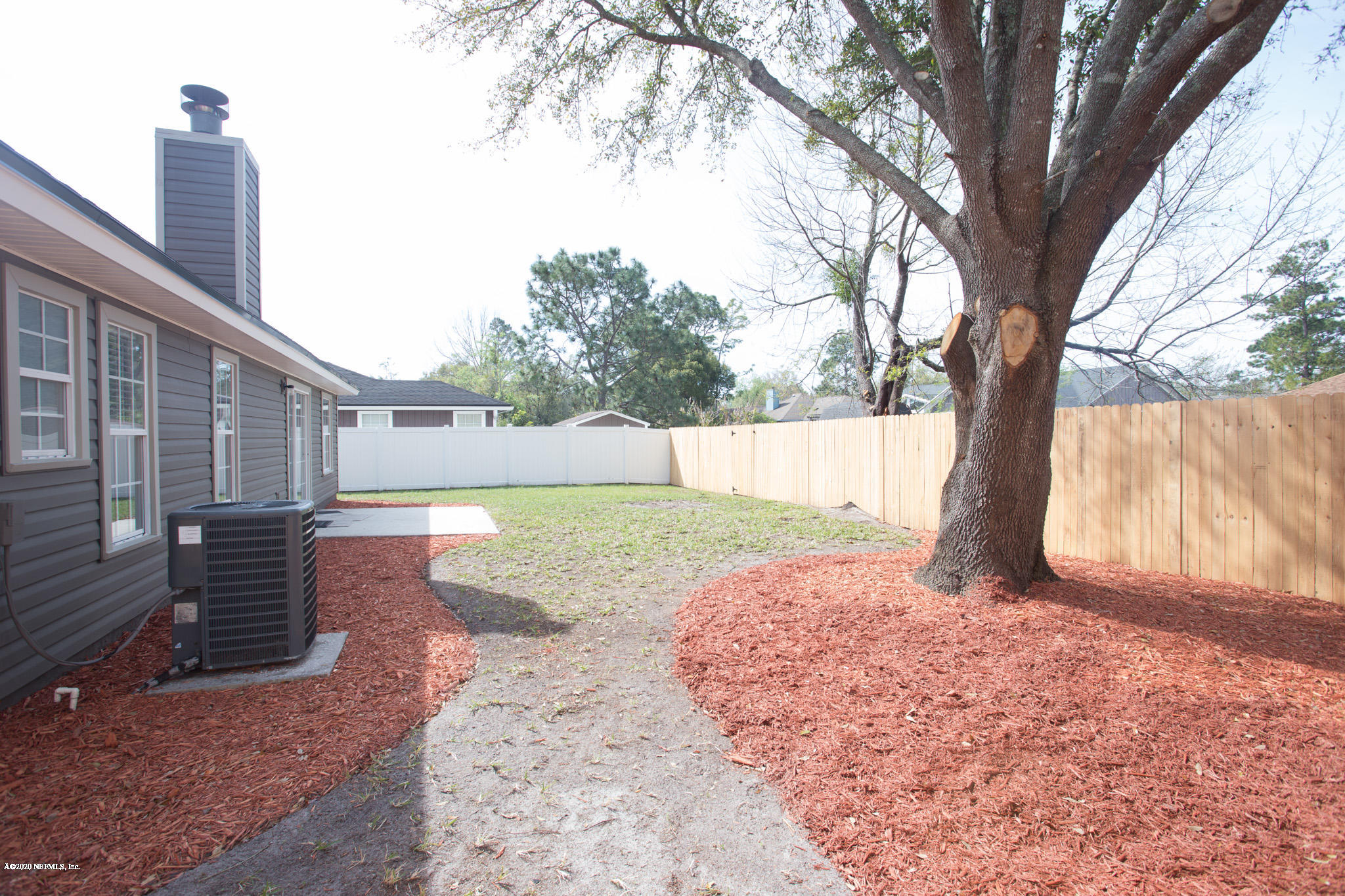 7864 Collins Ridge Boulevard Jacksonville, FL 32244 - Photo 31 of 32 a view of backyard with tree