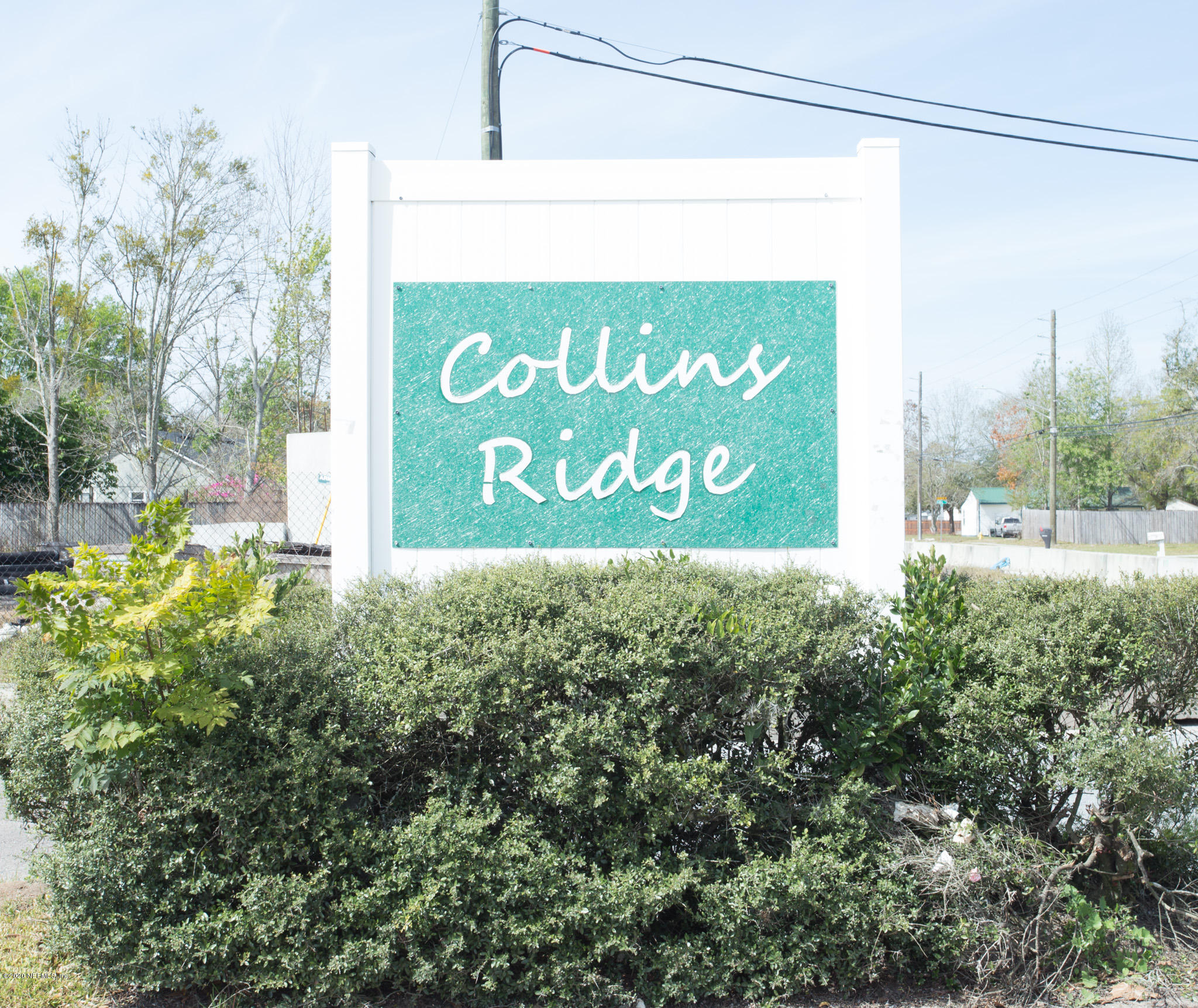 7864 Collins Ridge Boulevard Jacksonville, FL 32244 - Photo 32 of 32 a sign on the side of a building
