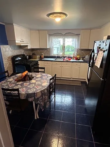 a bedroom with furniture and a fireplace