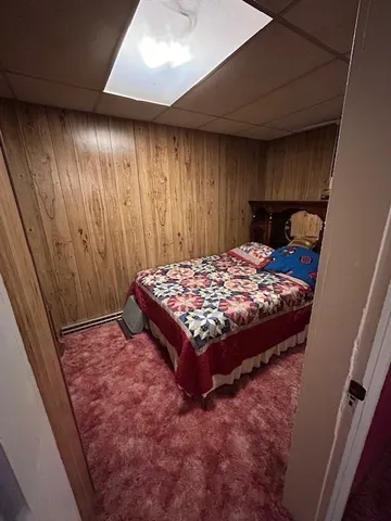 a view of a hallway with seating area