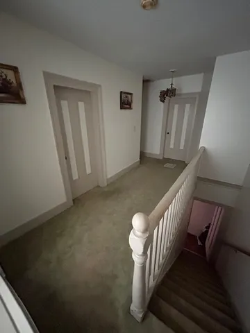 a bedroom with furniture and window