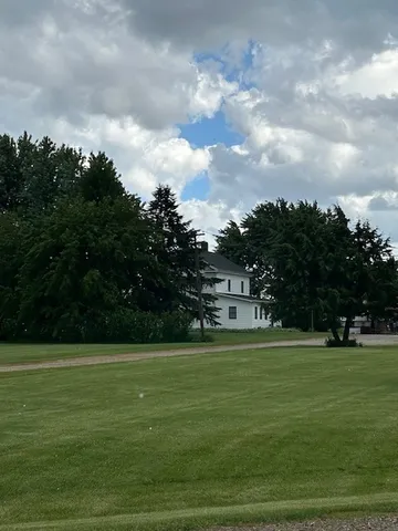 a view of a golf course with a lake