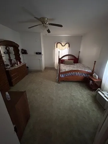 a living room with furniture rug and window