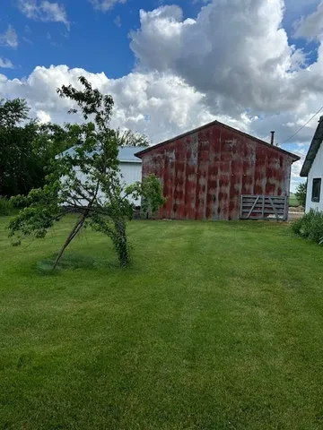 a view of a tree in front of a house