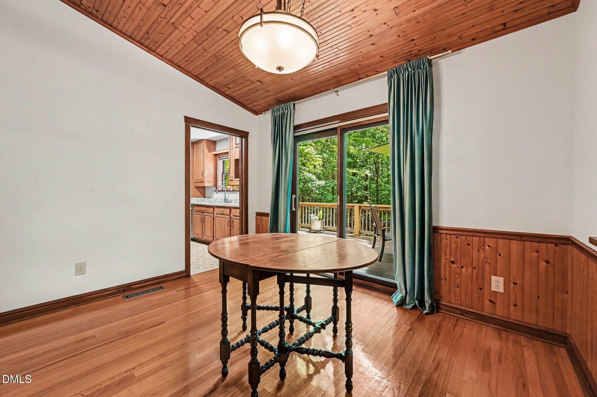 200 Spring Valley Road Carrboro, NC 27510 - Photo 11 of 38 a dining room with furniture window wooden floor