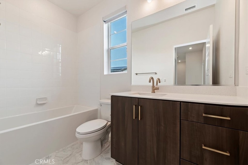 31680 Williams Way Rancho Mission Viejo, CA 92694 - Photo 13 of 20 a bathroom with a sink a toilet and a mirror
