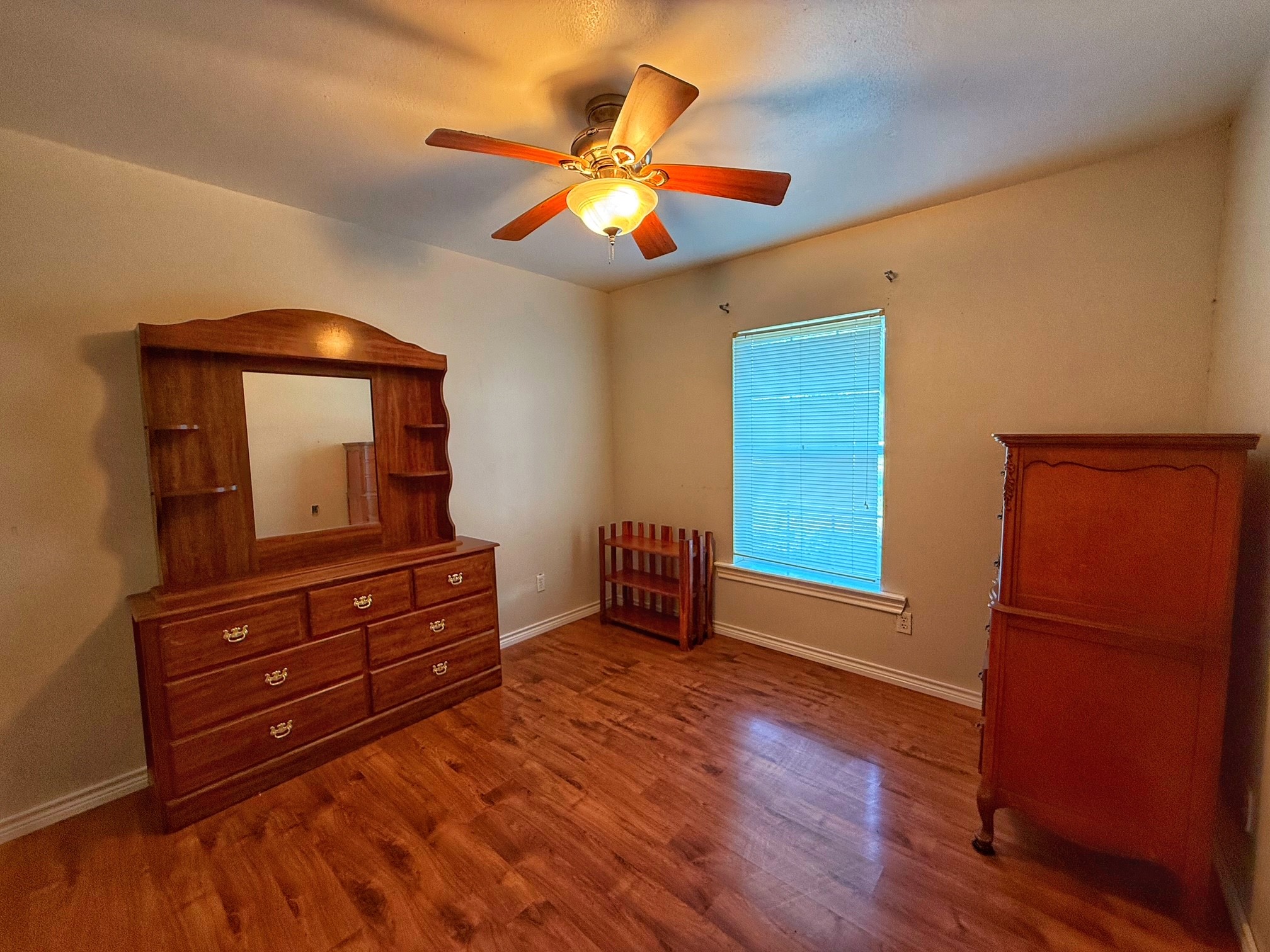 9496 Batson Road Normangee, TX 77871 - Photo 13 of 25 a room with bed and wooden floor