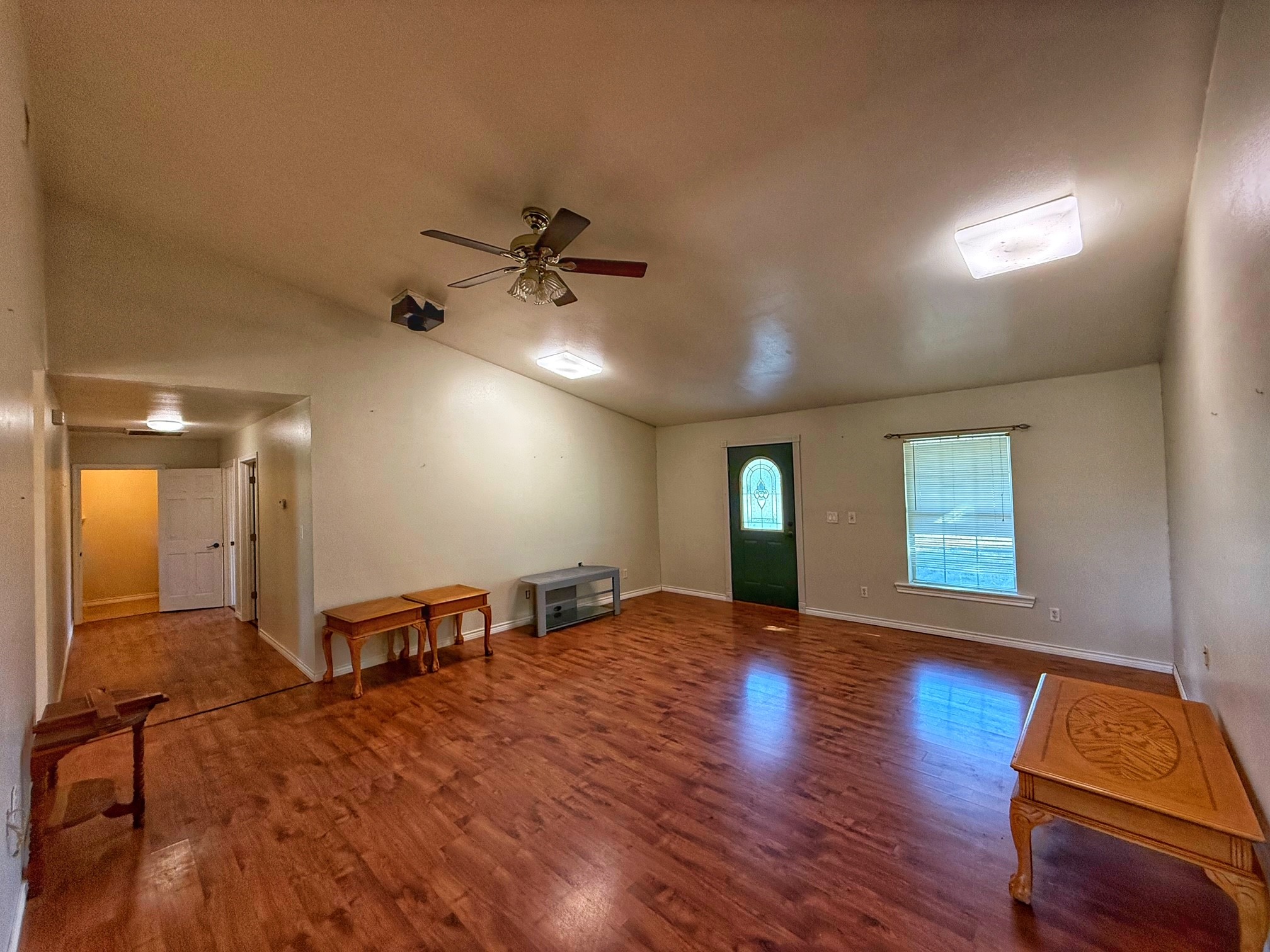 9496 Batson Road Normangee, TX 77871 - Photo 9 of 25 a view of an empty room with window and wooden floor