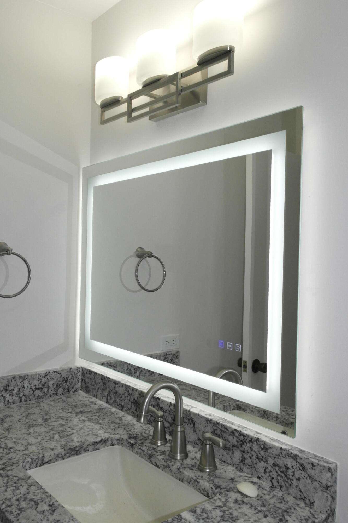 18890 Candlewick Drive, Unit B Boca Raton, FL 33496 - Photo 11 of 16 a bathroom with a sink and a mirror