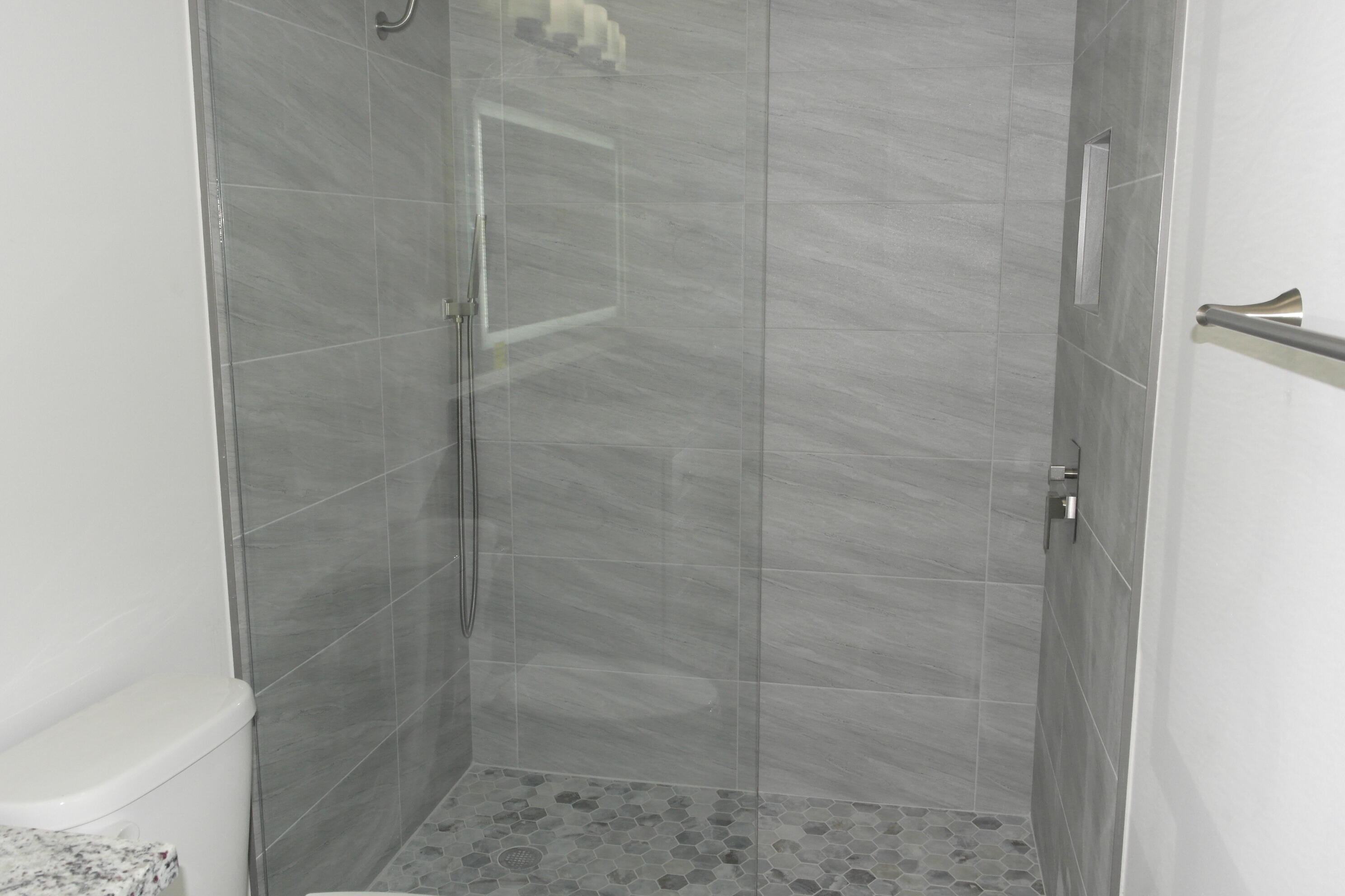 18890 Candlewick Drive, Unit B Boca Raton, FL 33496 - Photo 12 of 16 a bathroom with a shower