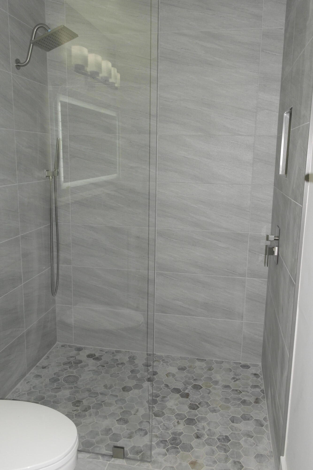 18890 Candlewick Drive, Unit B Boca Raton, FL 33496 - Photo 13 of 16 a bathroom with a toilet and a shower