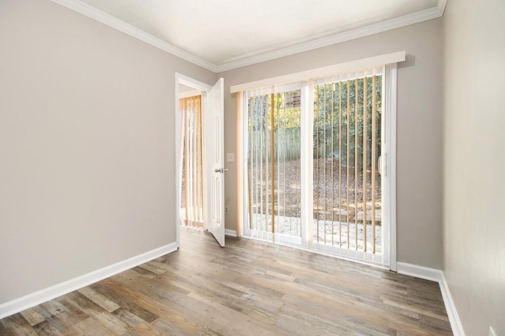 3521 Kingswood Trail Decatur, GA 30034 - Photo 11 of 26 a view of an empty room with wooden floor and a window