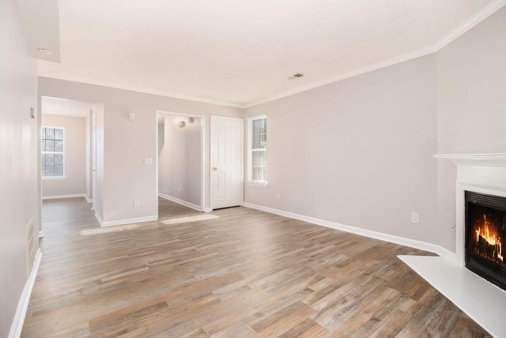 3521 Kingswood Trail Decatur, GA 30034 - Photo 12 of 26 a view of an empty room with a fireplace and a window