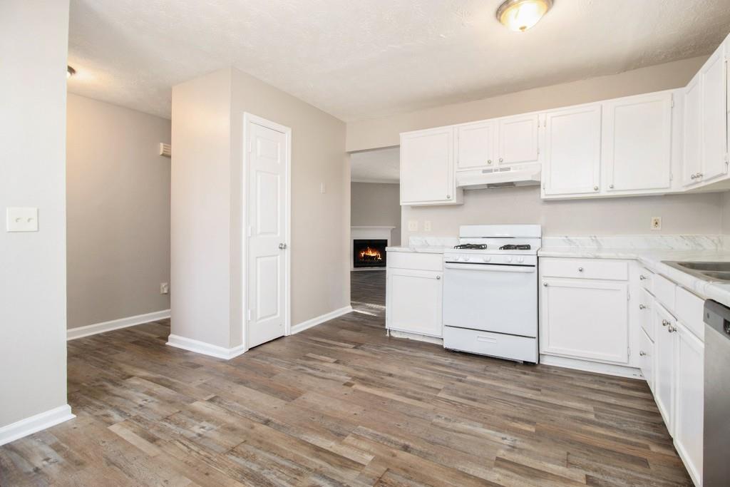 3521 Kingswood Trail Decatur, GA 30034 - Photo 14 of 26 a kitchen with white cabinets and white appliances