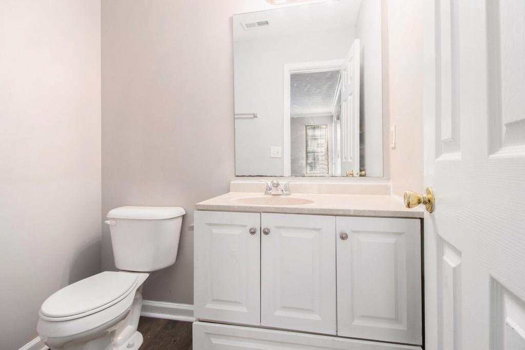 3521 Kingswood Trail Decatur, GA 30034 - Photo 15 of 26 a bathroom with a granite countertop toilet sink and mirror