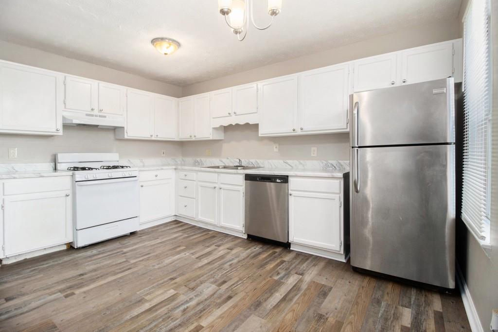 3521 Kingswood Trail Decatur, GA 30034 - Photo 3 of 26 a kitchen with white cabinets and white stainless steel appliances