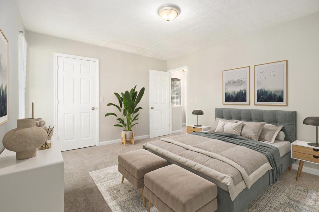 3521 Kingswood Trail Decatur, GA 30034 - Photo 4 of 26 a bedroom with a bed and a potted plant