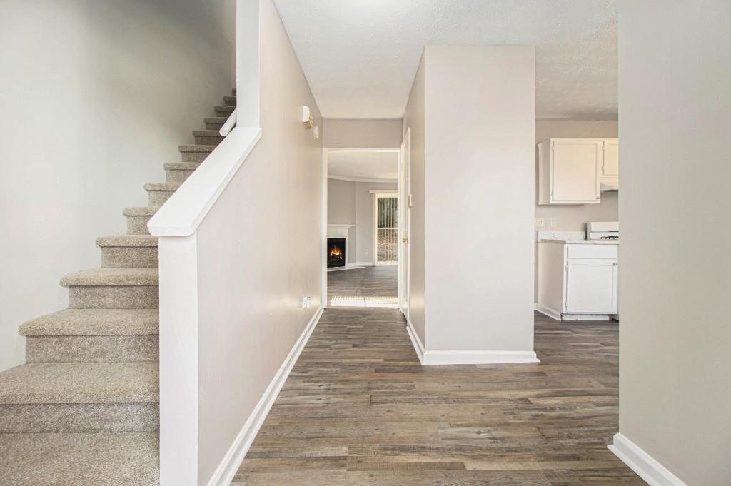 3521 Kingswood Trail Decatur, GA 30034 - Photo 9 of 26 a view of a hallway with wooden floor and staircase