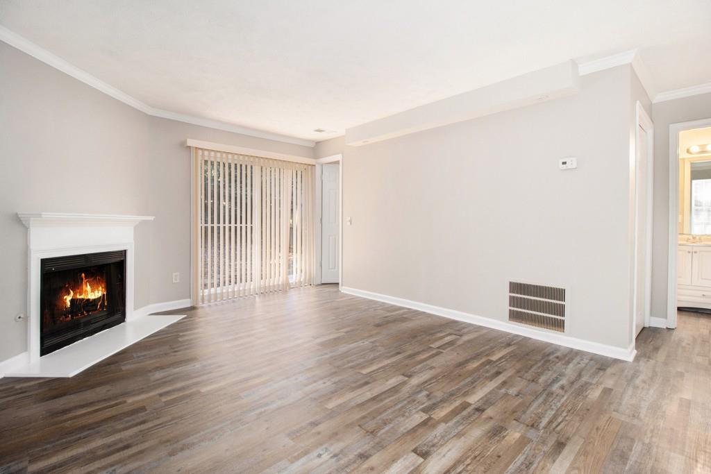 3521 Kingswood Trail Decatur, GA 30034 - Photo 10 of 26 a view of an empty room with a fireplace and a window