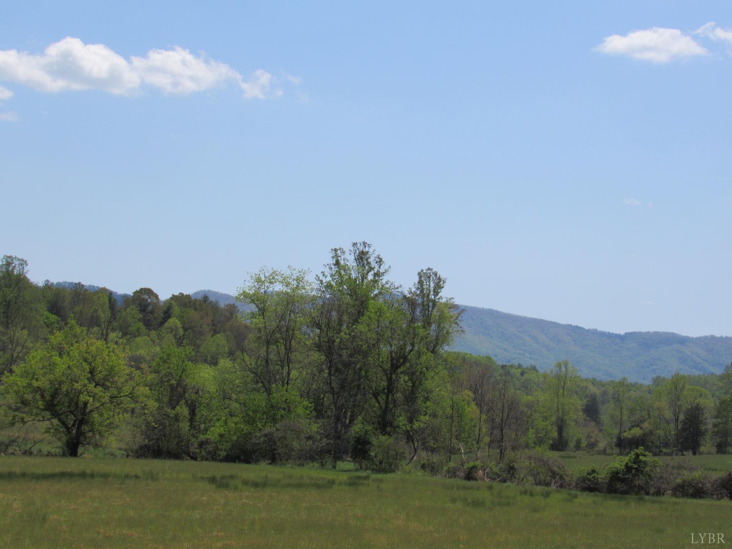 63 Sugar Hill Tunnel Road Amherst, VA 24521 - Photo 4 of 20 a view of mountain with lake in the background