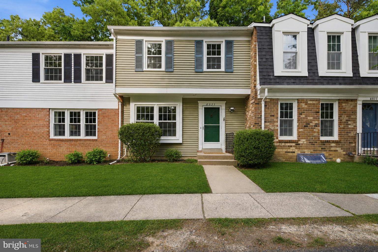 8575 Tyrolean Way Springfield, VA 22153 - Photo 1 of 29 a view of a yard in front of a brick house