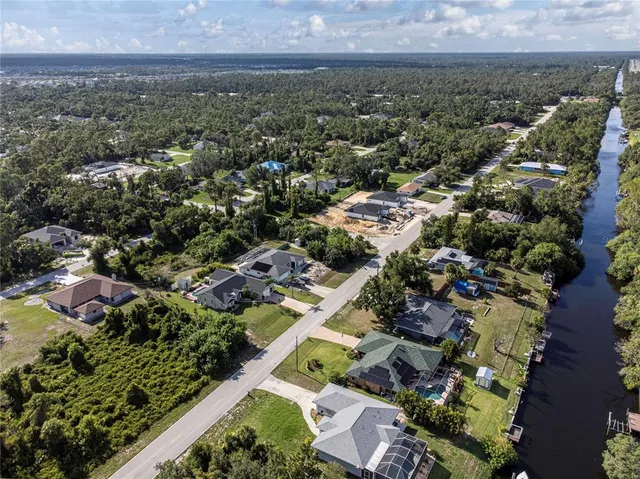 an aerial view of residential houses with outdoor space