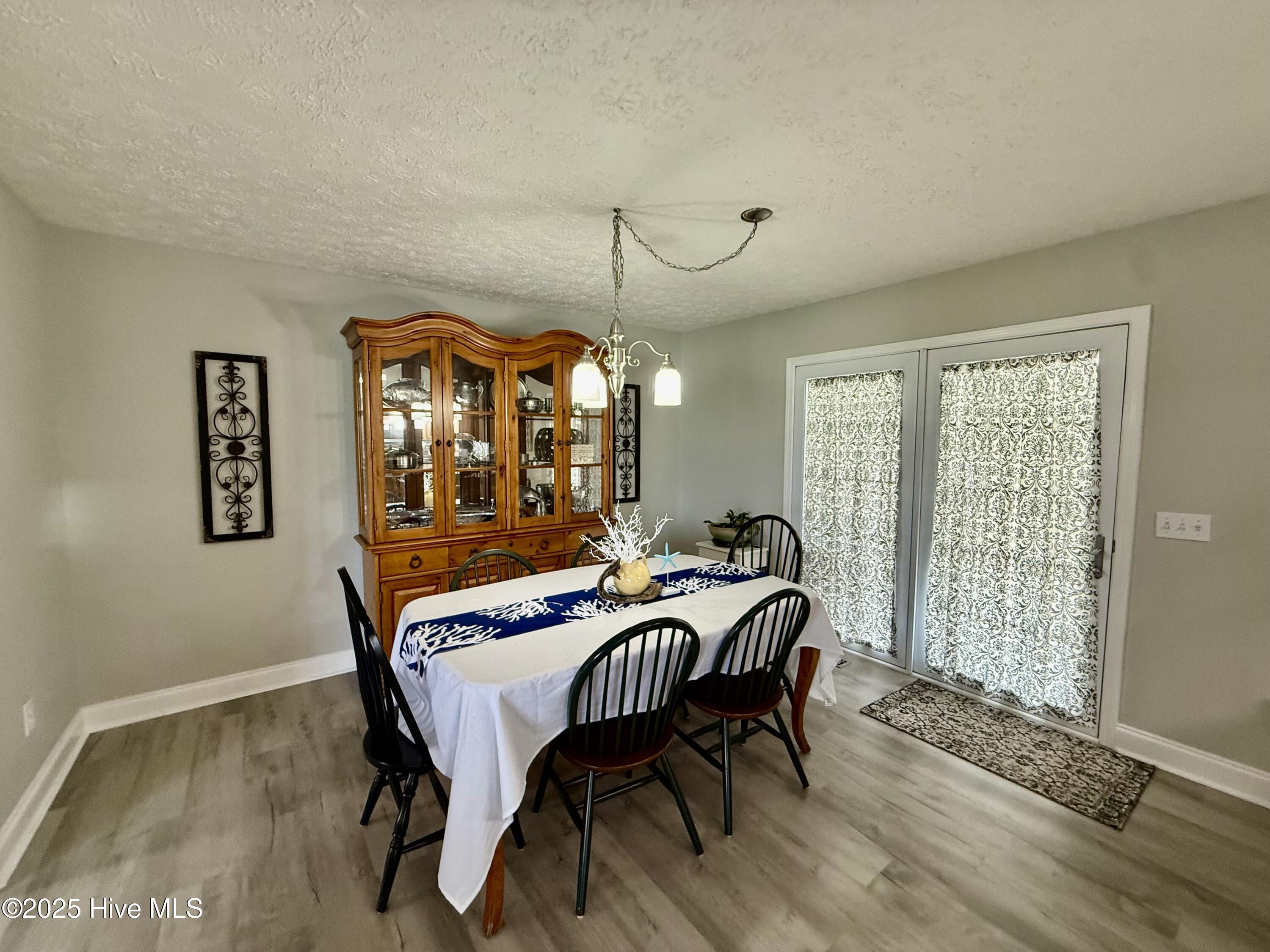 119 Cowpen Neck Road Edenton, NC 27932 - Photo 13 of 39 Covered back porch access in the dining room