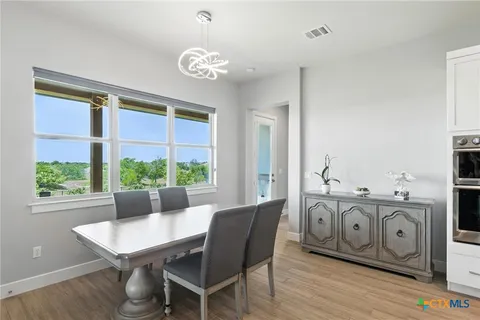 a view of a dining room with furniture window and outside view