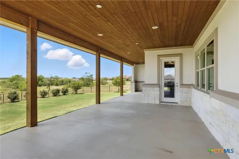 a view of a porch with a big yard