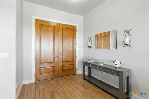 a view of a storage & utility room with wooden floor