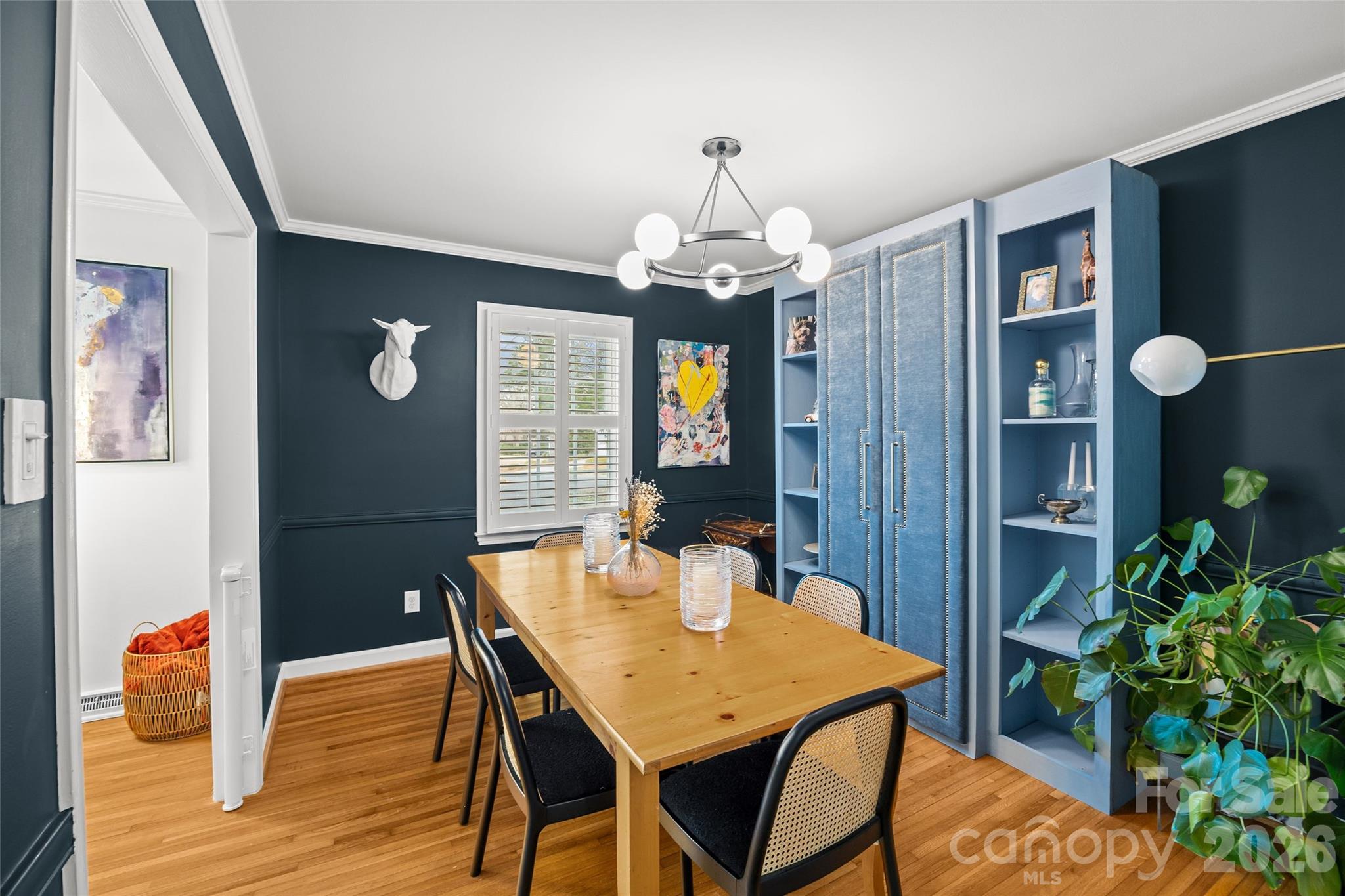2732 Burnt Mill Road Charlotte, NC 28210 - Photo 11 of 43 a view of a dining room with furniture wooden floor and chandelier