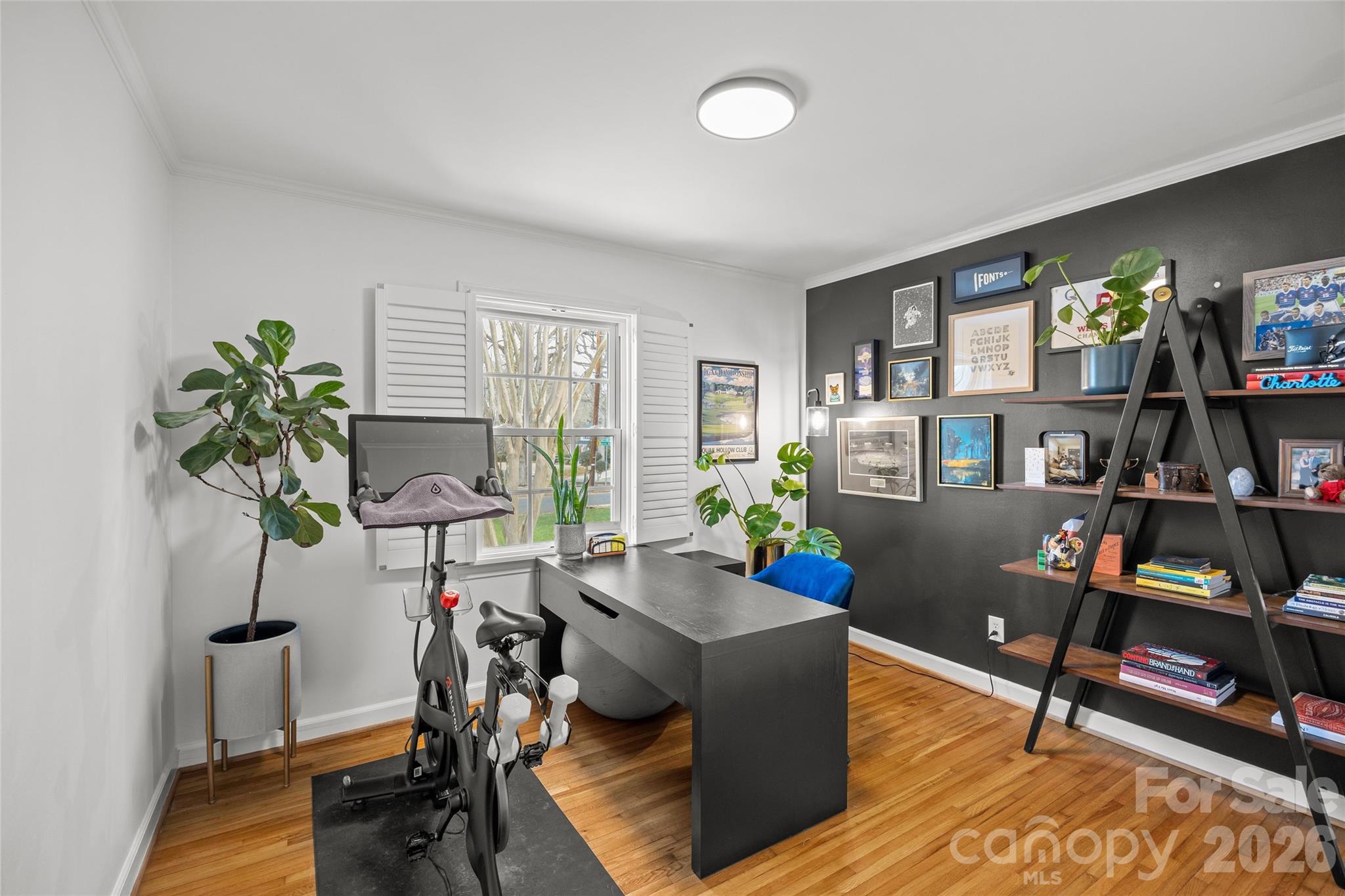 2732 Burnt Mill Road Charlotte, NC 28210 - Photo 31 of 43 a living room with furniture and a bookshelf