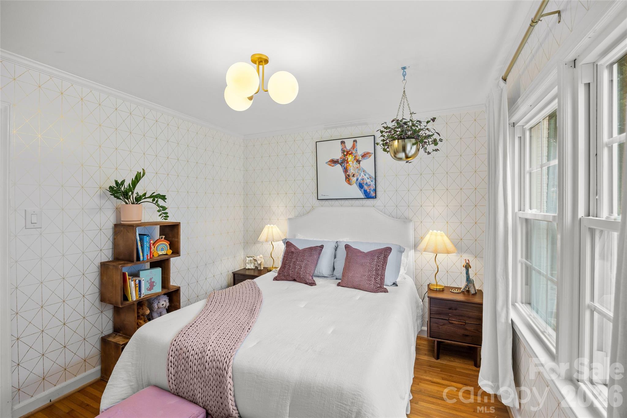 2732 Burnt Mill Road Charlotte, NC 28210 - Photo 37 of 43 a bedroom with a bed and a chandelier