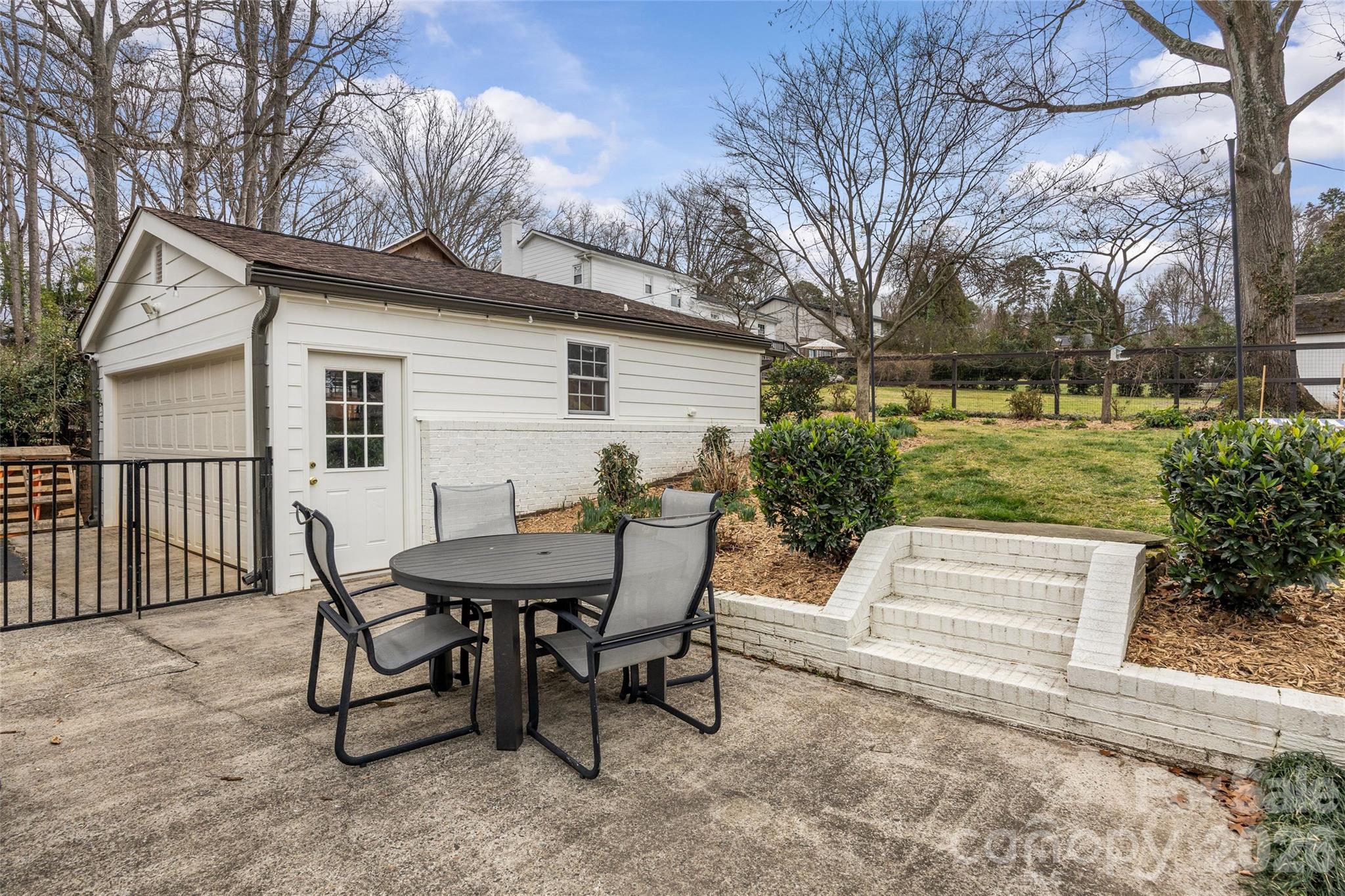 2732 Burnt Mill Road Charlotte, NC 28210 - Photo 39 of 43 a view of a house with backyard and sitting area