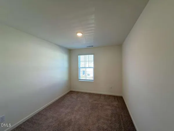 a view of a bathroom from a hallway