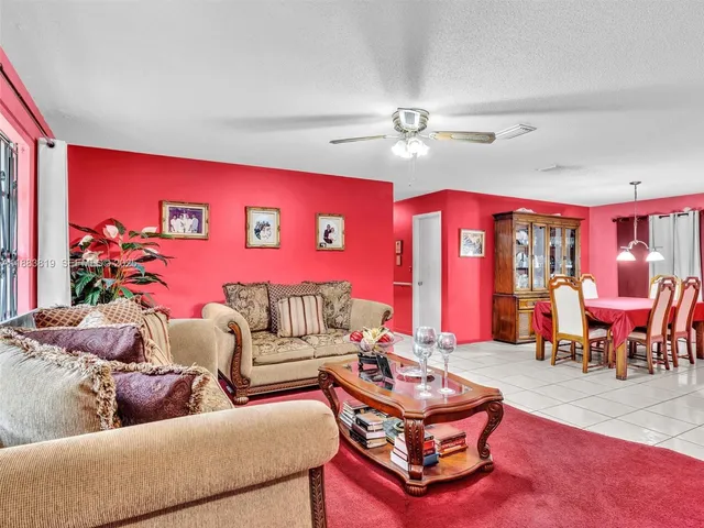 a living room with furniture and window