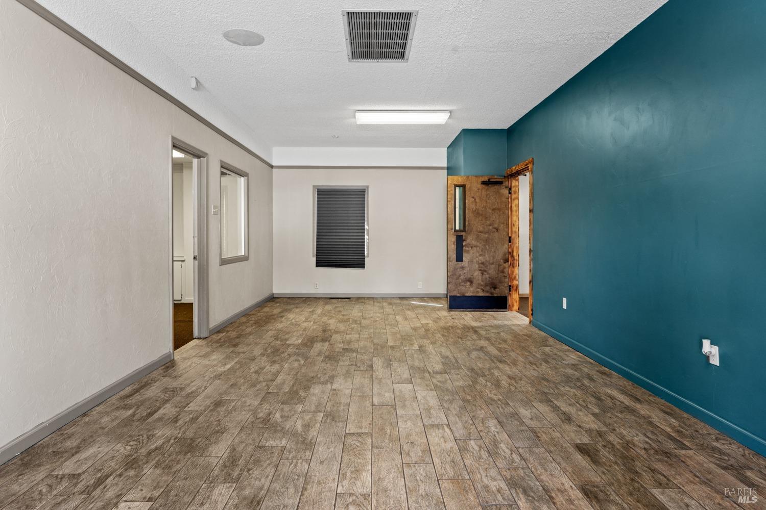 195 Low Gap Road Ukiah, CA 95482 - Photo 2 of 13 an empty room with windows