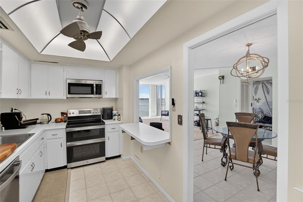 100 Pierce Street, Unit 703 Clearwater, FL 33756 - Photo 14 of 70 a large white kitchen with stainless steel appliances