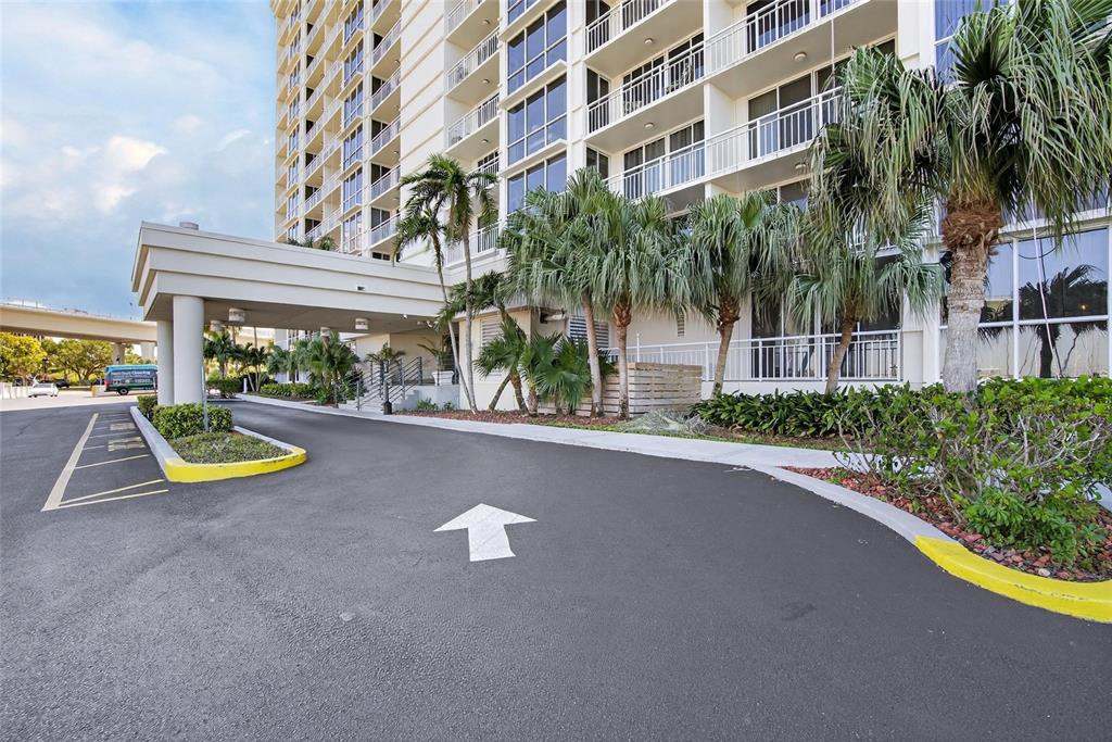 100 Pierce Street, Unit 703 Clearwater, FL 33756 - Photo 50 of 70 a view of swimming pool with outdoor seating and house in the background